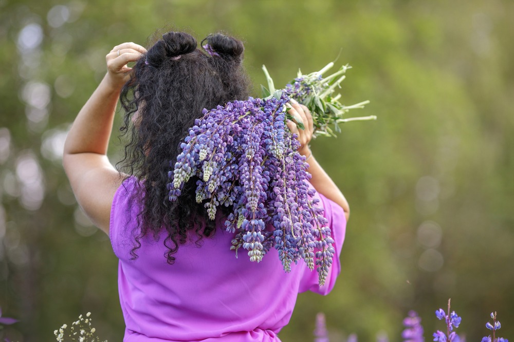 a-girl-with-curly-hair-in-the-summer-in-a-field-of-2024-07-13-02-44-40-utc (1)